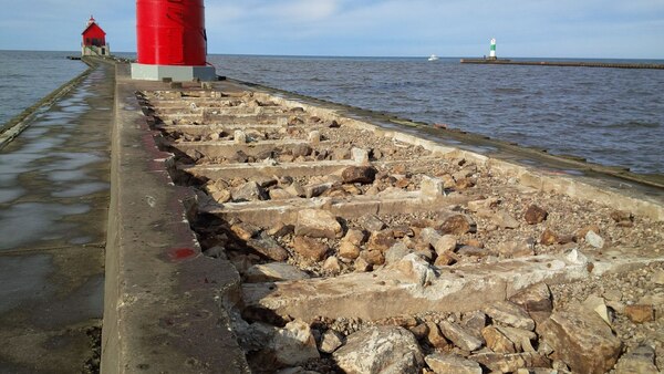 Grand Haven south pier construction underway approximately 100 feet of concrete cap has been removed to date, work has been halted for the season due to weather and will resume in the spring. (U.S. Army Photo)