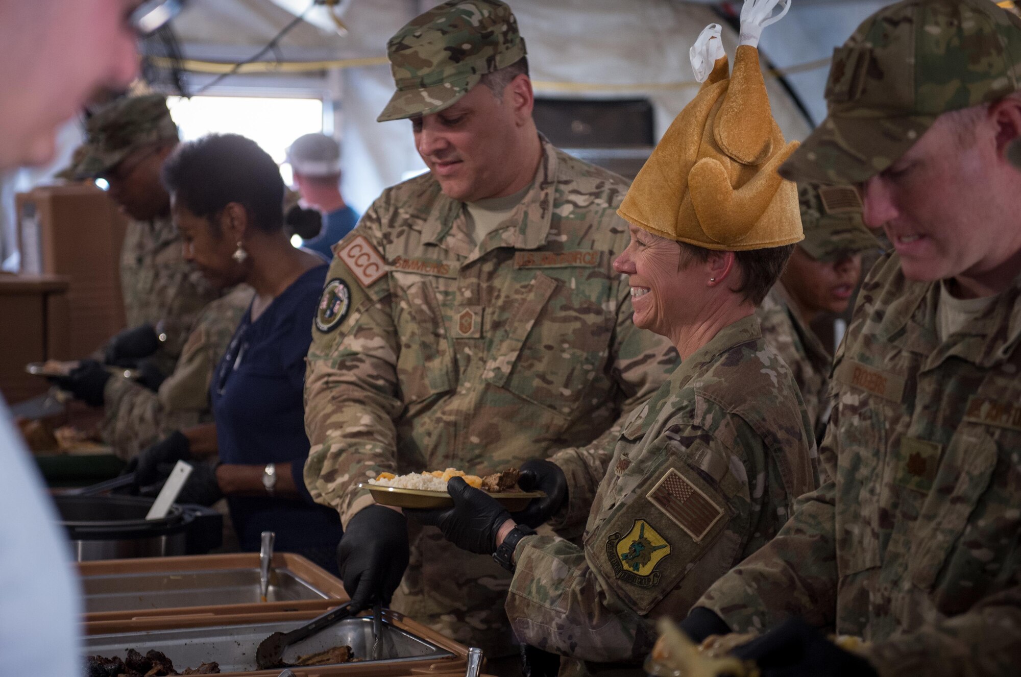 Lt. Col. Marlyce Roth, 724th Expeditionary Air Base Squadron commander, and other Air Force leadership serves Thanksgiving lunch at Air Base 201 in Agadez, Niger, Nov. 24, 2016. During a three day trip, Lt. Gen. Richard Clark, 17th Expeditionary Air Force commander, visited Airmen in Europe and Africa who support the Air Force's intelligence, surveillance and reconnaissance mission. This was Clark's first visit to NAS Sigonella, Niamey and Agadez as 3rd Air Force commander. (U.S. Air Force photo by Tech. Sgt. Ryan Crane)