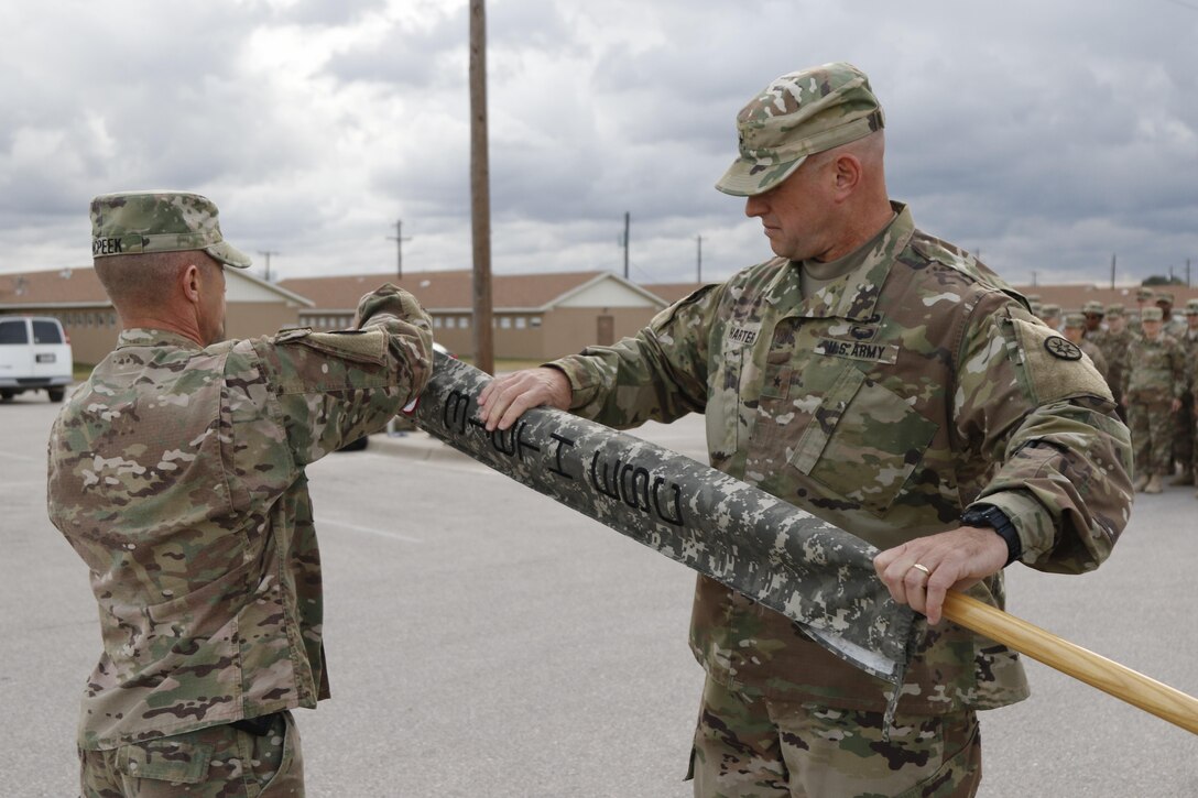 The 316th Sustainment Command (Expeditionary), an Army Reserve unit based out of Coraopolis, Pa., performs a casing of the colors and guidon prior to deploying to Kuwait at North Fort Hood, Tx., Nov. 28, 2016. (U.S. Army photo by Staff Sgt. Dalton Smith)