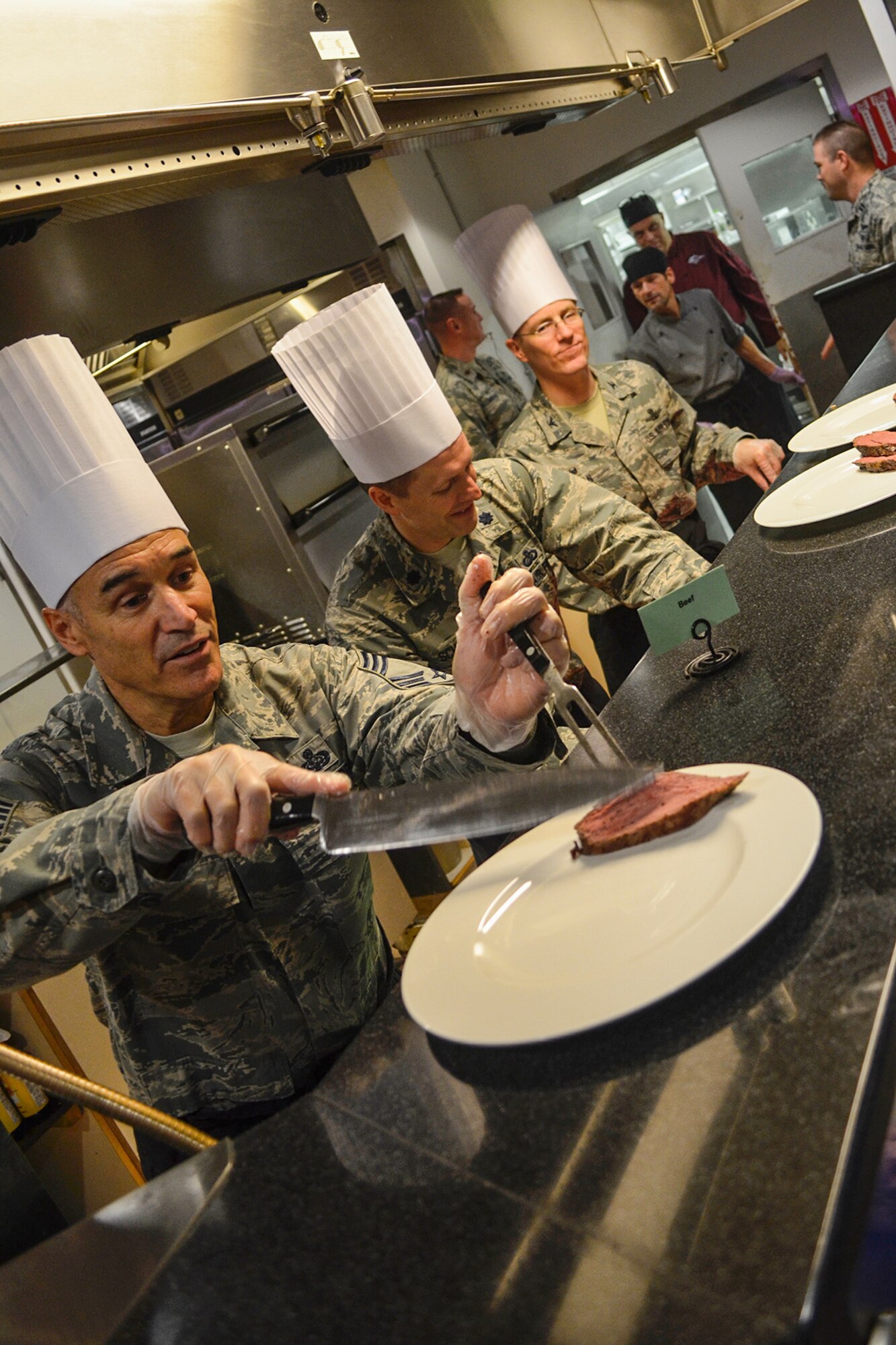 THULE AIR BASE, Greenland - Senior leaders from the 821st Air Base Wing serve Thanksgiving meals at the Dundas Buffet Restaurant to approximately 222 Airmen and international partners who are stationed at Thule Air Base, Greenland, Nov. 24, 2016. The buffet restaurant provided 312 pounds of turkey, 80 pounds of tenderloin, 80 pounds of ham and 48 pies to the base members. (Courtesy photo by Master Sgt. Stoney Bair)