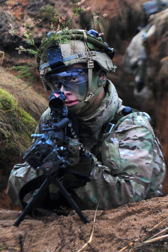 Army Sgt. Robert Perry defends his position during Exercise Iron Sword 2016 in Pabrade, Lithuania, Nov. 24, 2016. Perry is assigned to Company A, 2nd Battalion, 503rd Infantry Regiment, 173rd Infantry Brigade Combat (Airborne). Army photo by Staff Sgt. Corinna Baltos