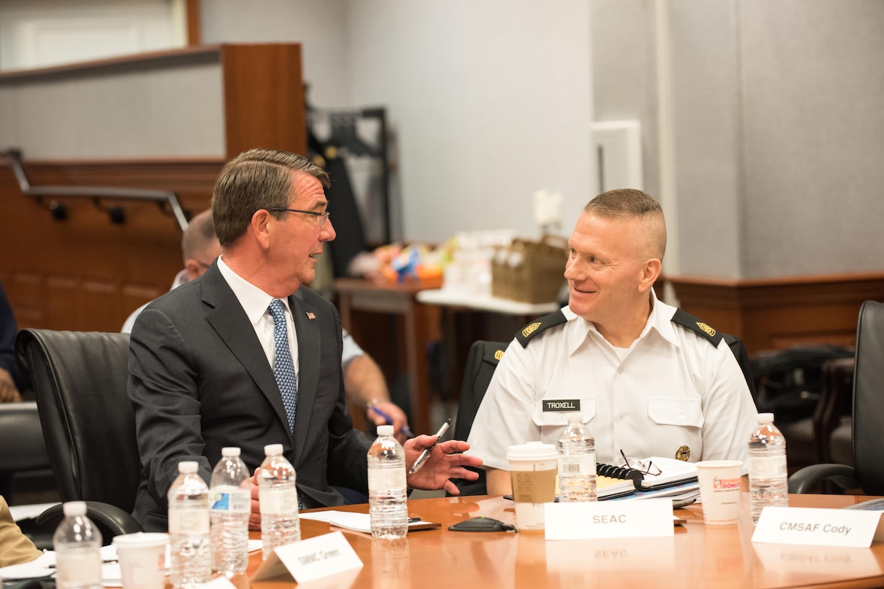Defense Secretary Ash Carter speaks with Army Command Sgt. Maj. John W. Troxell before addressing senior enlisted members of the armed forces during the Defense Senior Enlisted Leader Conference at the Pentagon, Nov. 30, 2016. DoD photo by Army Sgt. Amber I. Smith