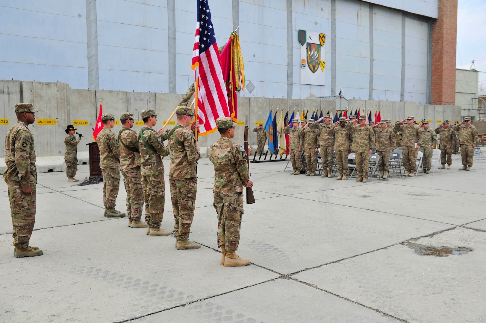 BAGRAM AIRFIELD, AFGHANISTAN (Nov. 29, 2016) - Leaders, Soldiers, and guests render honors to the flag during the playing of the national anthem at the transfer of authority ceremony between the 63rd Ordnance Battalion (Explosive Ordnance Disposal) and the 184th Ord. Bn. (EOD).  Photo by Bob Harrison, U.S. Forces Afghanistan Public Affairs.
