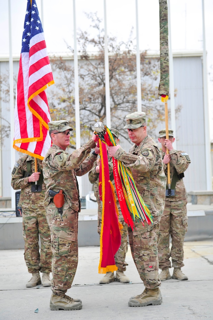 BAGRAM AIRFIELD, AFGHANISTAN (Nov. 29, 2016) - U.S. Army Lt. Col. Edward 'Keith' Rowsey and Command Sgt. Maj. Matthew R. Boehme case the colors of the 63th Ordnance Battalion (Explosive Ordnance Disposal) in preparation for their redeployment to Fort Drum, N.Y.  The 63rd EOD transferred its Task Force EOD mission to the 184th EOD Bn. in a ceremony held here today.  Photo by Bob Harrison, U.S. Forces Afghanistan Public Affairs.