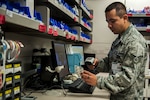 Staff Sgt. Victor Rodriguez, 99th Medical Support Squadron pharmacy technician, scans a medication into the Pyxis database at the Mike O’Callaghan Federal Medical Center on Nellis Air Force Base, Nev., Nov. 22, 2016. 18 new Pyxis machines were implemented throughout the wards of the MOFMC in March, and with these new machine the pharmacy changed the way that each medication was utilized in the system. (U.S. Air Force photo by Airman 1st Class Kevin Tanenbaum/Released) 