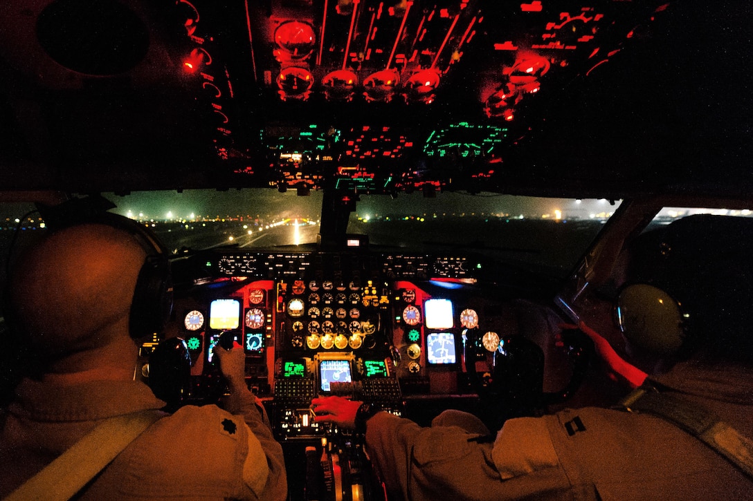 Air Force Lt. Col. John Harbour, left, and Capt. Timothy Gaumer takeoff in a KC-135 Stratotanker aircraft from Al Udeid Air Base, Qatar, Nov. 29, 2016. Harbour is a pilot assigned to the 340th Expeditionary Air Refueling Squadron. Gaumer is a co-pilot assigned to the 349th Expeditionary Air Refueling Squadron. The squadrons extend the fight by delivering 60,000 pounds of fuel to A-10 Thunderbolts, F-15 Strike Eagles and Marine Crops EA-6B Prowlers. Air Force photo by Senior Airman Jordan Castelan