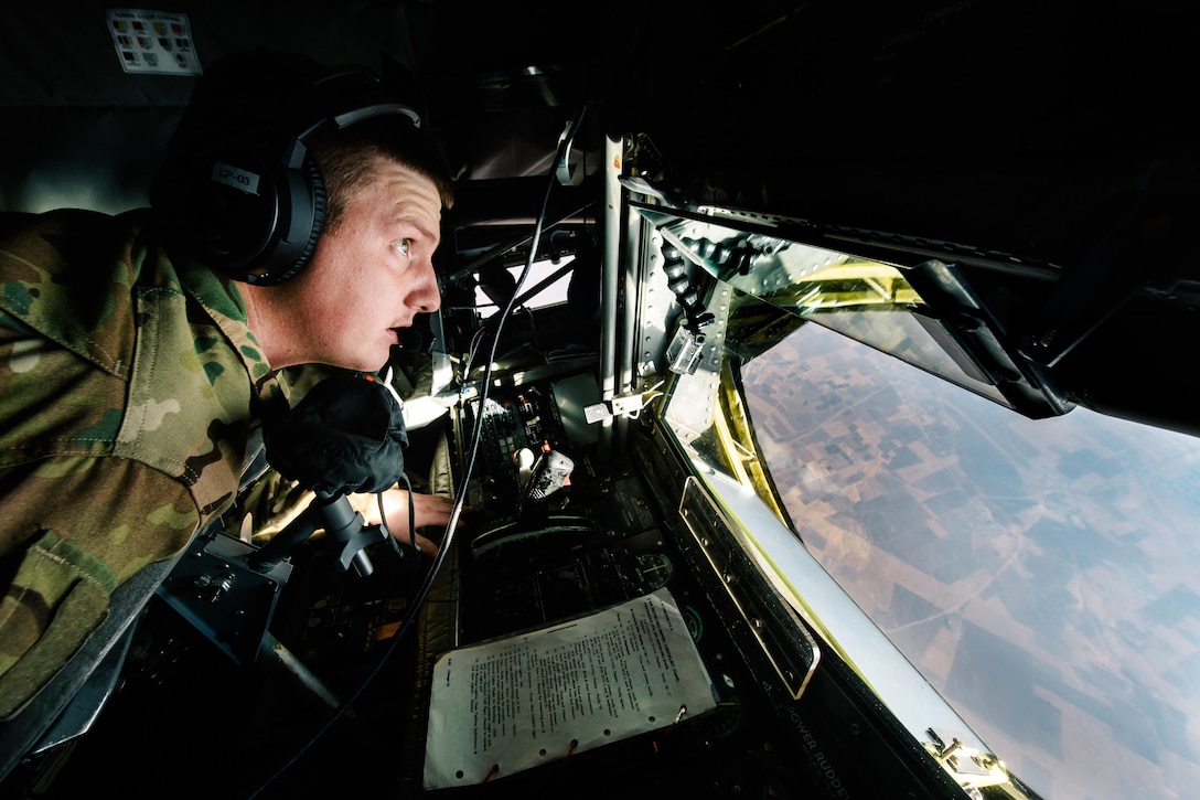 Air Force Senior Airman Kix Payne prepares to refuel a Marine Corps EA-6B Prowler over Iraq, Nov. 29, 2016. Payne is a boom operator assigned to the 340th Expeditionary Air Refueling Squadron. Air Force photo by Senior Airman Jordan Castelan