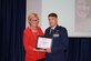 Capt. Adam Huffman, 366th Operation Squadron executive officer, receives a certificate from Katherine Hansen, Community Parthnerships of Idaho executive director, during a lucheon ceremony at Boise State University, in Boise, Idaho, Oct. 6, 2016. The 391st Fighter Squadron was nominated for the Opening Doors Award for its dedication to helping individuals with disabilities. More than 540 attendees recognized the achievements of this year's 17 nominees. (Courtesy Photo)