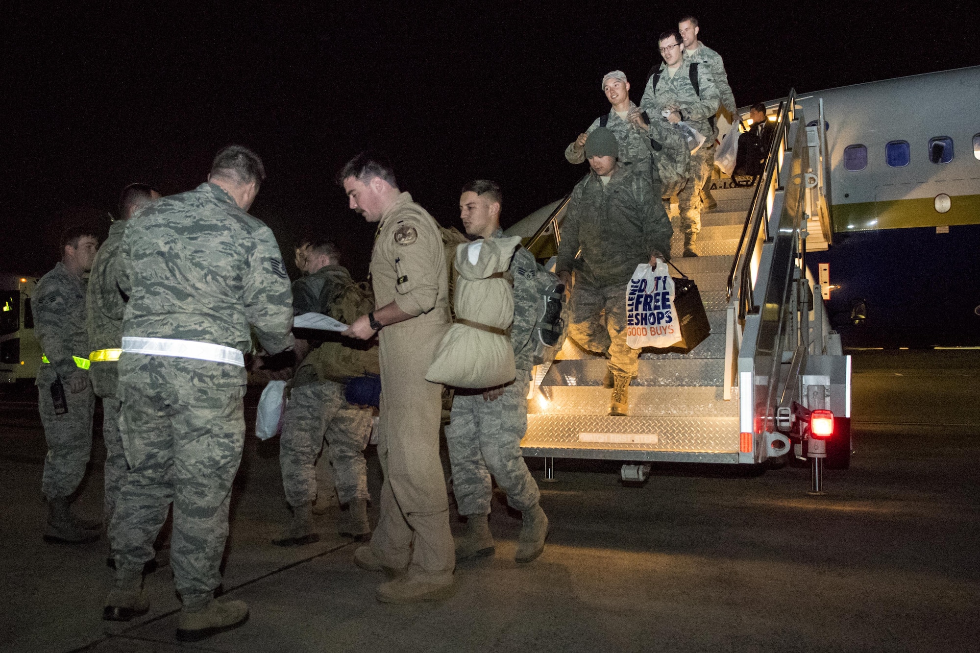 Airmen from the 4th Maintenance Group and 335th Fighter Squadron return from a deployment to an undisclosed location in Southwest Asia, Nov. 23, 2016, at Seymour Johnson Air Force Base, North Carolina. More than 80 members returned just in time for the holidays with the bulk of the deployers having returned a month prior. (U.S. Air Force photo by Airman Shawna L. Keyes)