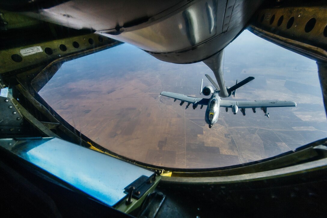 An Air Force A-10 Thunderbolt refuels from a KC-135 Stratotanker over Iraq, Nov. 29, 2016, in support of Operation Inherent Resolve. Air Force photo by Senior Airman Jordan Castelan