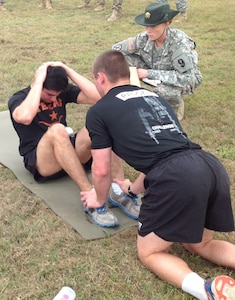 Army ROTC cadets from University of Texas at Austin take part in a physical training test at the fifth annual 5th Brigade ROTC Ranger Challenge Competition Nov. 5-6 at Joint Base San Antonio-Camp Bullis.