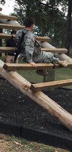 An Army ROTC cadet from the University of Texas at Austin goes through the confidence course during the fifth annual 5th Brigade ROTC Ranger Challenge Competition Nov. 5-6 at Joint Base San Antonio-Camp Bullis.