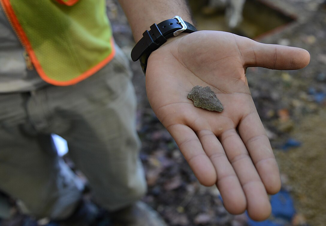 A projectile point, estimated to be from the Archaic period, was found during an excavation at Joint Base Langley-Eustis, Va., Nov. 4, 2016. Archeologists and their teams excavated three new sites on the installation to determine their historical significance and record their findings. (U.S. Air Force photo by Staff Sgt. Teresa J. Cleveland)