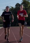 Sean Kerr, Military Sealift Command director, has been a guide for 1st Lt. Lauryn Thomas, a 375th Air Mobility Wing executive director. Kerr, a retired Marine and a fellow Road Warrior, has supported Thomas, a marathon runner, and mentored her for the past two years. (U.S. Air Force Photo by Senior Airman Megan Friedl)