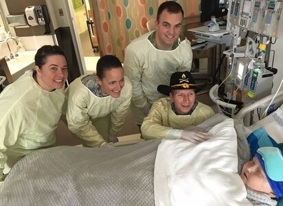 Washington National Guard members visit with Rowan Windham, right, an honorary member of the Texas National Guard, at Seattle Children's Hospital in Seattle, Washington, Oct. 28, 2016. Texas Command Senior Enlisted Leader Command Sgt. Maj. Mark Weedon asked the Washington National Guard to visit Rowan on behalf of Texas. 