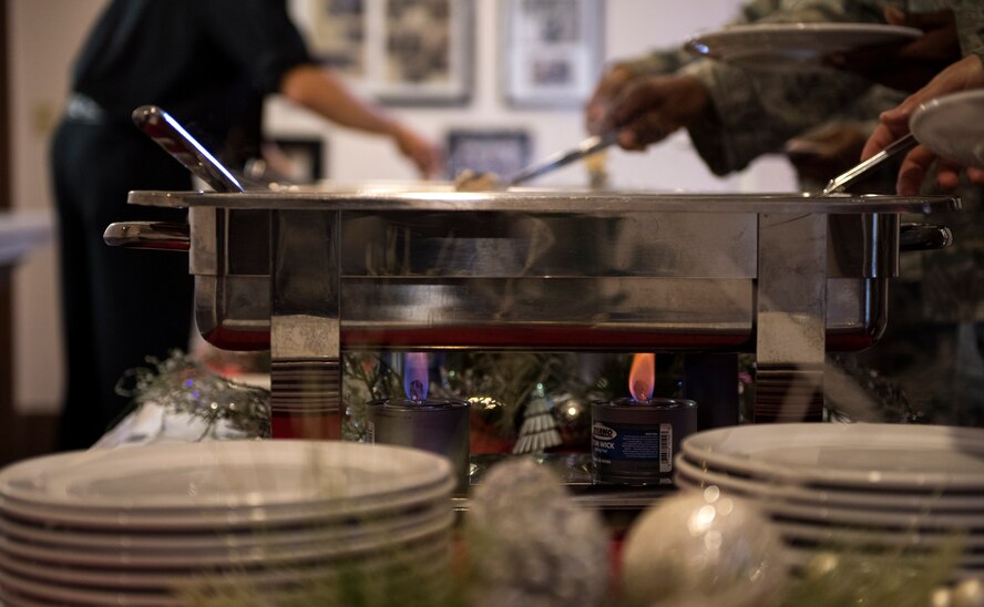 Attendees proceed through a buffet line during a Georgia State Air Force Association awards program, Nov. 29, 2016, at Moody Air Force Base, Ga. The program was hosted by the AFA to honor 10 winners who competed against other active duty members, reservists and guardsmen stationed at various installations in Georgia. (U.S. Air Force photo by Airman 1st Class Janiqua P. Robinson)