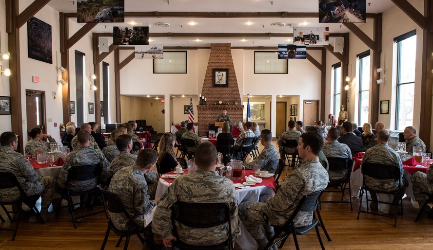 An audience listens to Col. Jason Gingrich, 347th Rescue Group commander, as he gives his remarks, Nov. 29, 2016, at Moody Air Force Base, Ga. Gingrich talked about the importance of putting forth your best effort in every task and not being afraid to be innovative while staying within the guidelines. (U.S. Air Force photo by Airman 1st Class Janiqua P. Robinson)