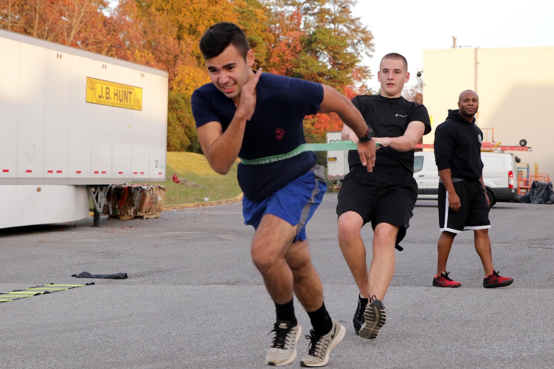 Demetri E. Ramos with Marine Corps Recruiting Sub-Station Glen Burnie, Marine Corps Recruiting Station Baltimore, Marine Corps Recruiting Command, performs a “buddy exercise” during a physical training session in Glen Burnie, Maryland, November 15, 2016. Young men and women awaiting boot camp conduct physical training sessions with their Marine Corps recruiters before going to boot camp at Marine Corps Recruit Depot Parris Island, South Carolina. (U.S. Marine Corps photo by Sgt. Devin Nichols/Released)