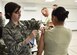 Second Lt. Kristina Valentic, a clinical nurse with the 910th Medical Squadron, administers a dose of influenza vaccine to an Airman at the 910th Logistics Readiness Squadron Deployment Center here, Nov. 5, 2016. U.S. Servicemembers are required to receive the vaccine annually to protect against influenze and help maintain the medical readiness of the force. (U.S. Air Force photo/Staff. Sgt. Rachel Kocin) 