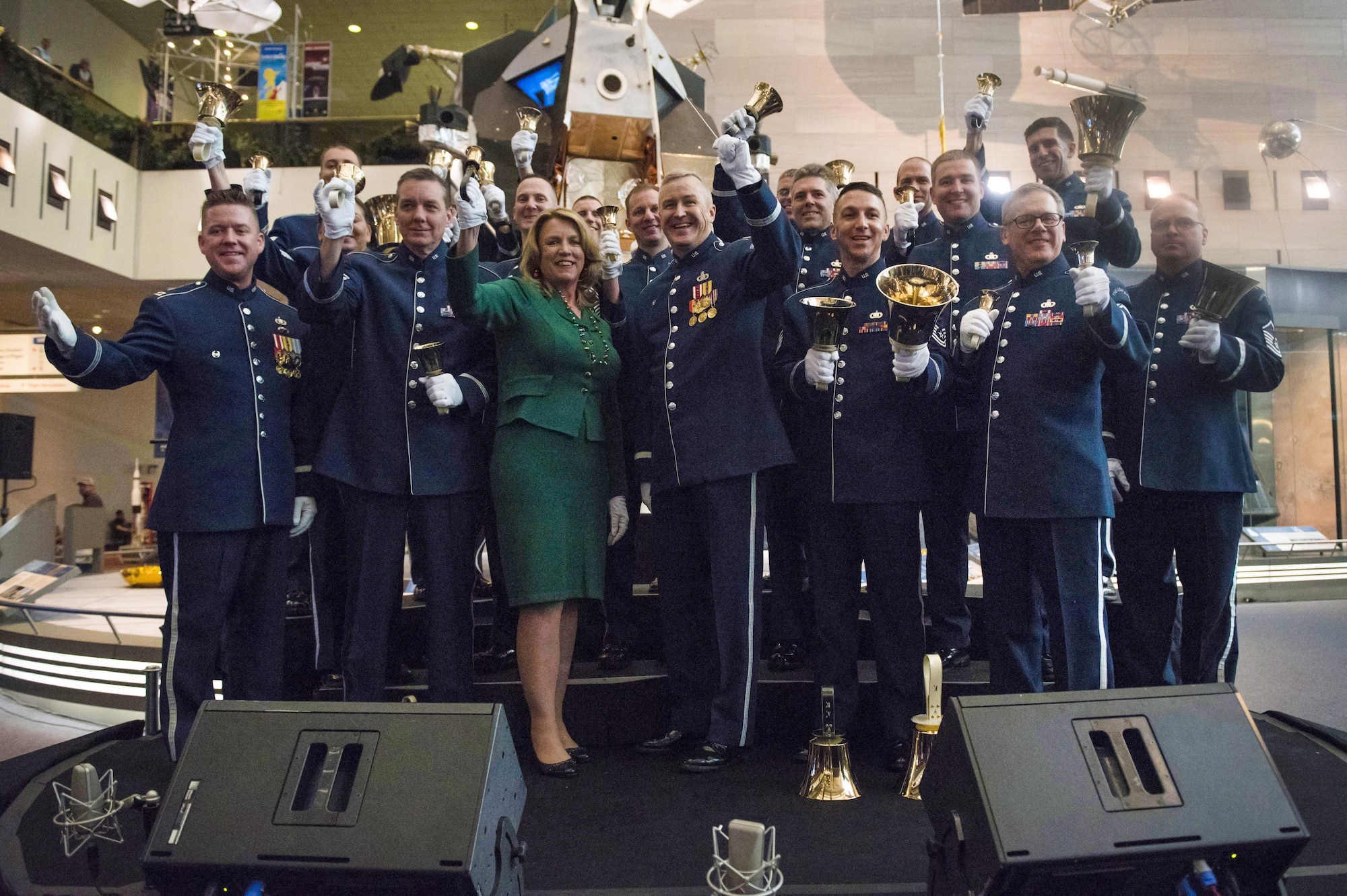 Secretary of the Air Force Deborah Lee James poses for a photo with members of the U.S. Air Force band after participating in a flash mob at the Smithsonian National Air and Space Museum in Washington D.C., with other members of the U.S. Air Force Band and their sister unit the U.S. Air Force Honor Guard, in order to kick off the holiday season by surprising visitors at the Smithsonian's National Air and Space Museum with a flash mob experience Nov. 29, 2016  (U.S. Air Force photo by Senior Master Sgt. Adrian Cadiz)(Released)
