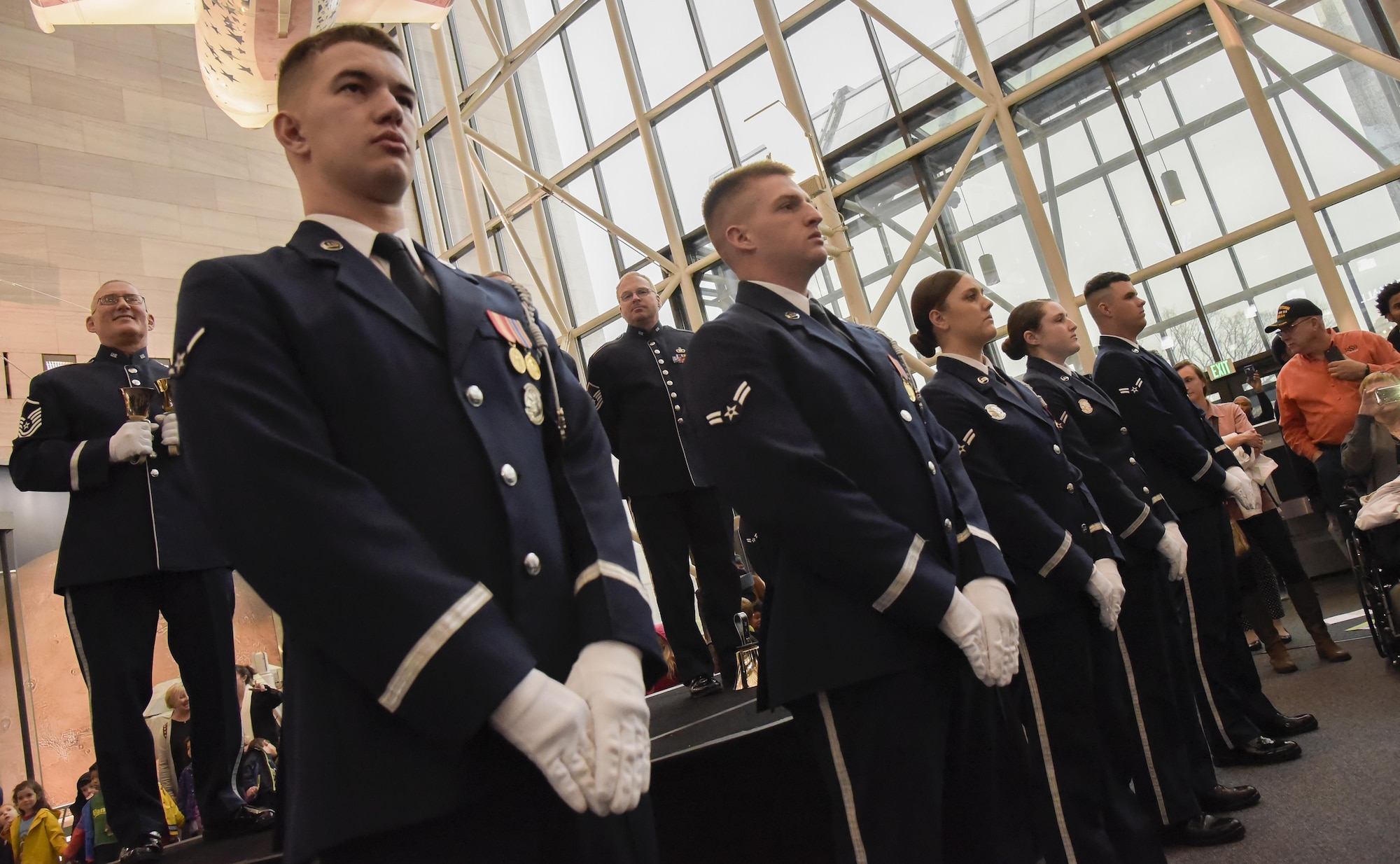 U.S. Air Force Honor Guard members played several critical rolls in helping the U.S. Air Force Band pull off the annual holiday flash mob performance at the Smithsonian National Air and Space Museum in Washington, D.C., Nov. 29, 2016. (U.S. Air Force photo by Jim Varhegyi) (released)