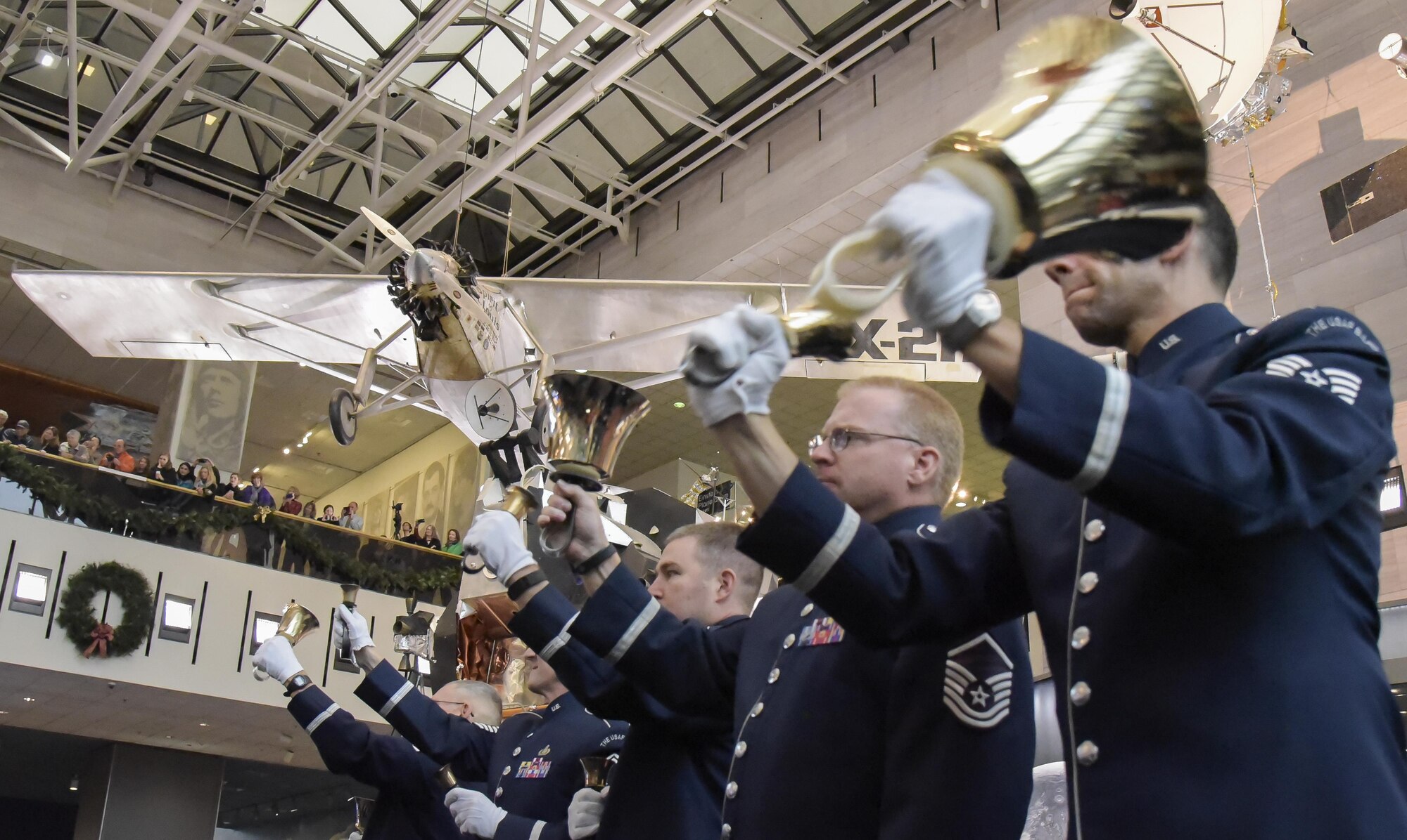 U.S. Air Force Band members play handbells during the band's annual holiday flash mob performance at the Smithsonian National Air and Space Museum in Washington, D.C., Nov. 29, 2016. (U.S. Air Force photo by Jim Varhegyi)(released)