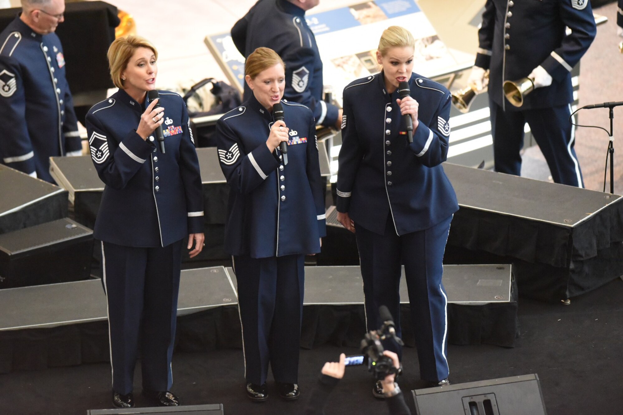 U.S. Air Force Band Commander Col. Larry H. Lang conducts the band's annual holiday flash mob performance at the Smithsonian National Air and Space Museum in Washington, D.C., Nov. 29, 2016. (U.S. Navy photo by JBAB/PA)