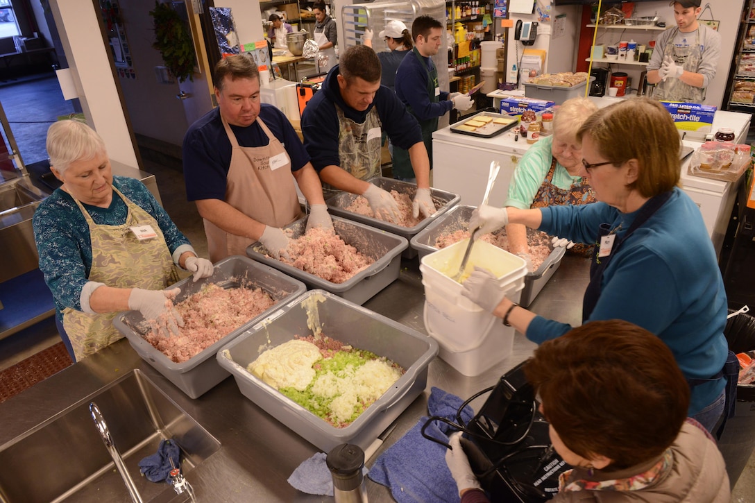Coast Guard members partner with other volunteers to make sandwiches and care packages for the homeless at the Downtown Soup Kitchen Hope Center in Anchorage, Alaska, Nov. 29, 2016. Coast Guard photo by Petty Officer 1st Class.