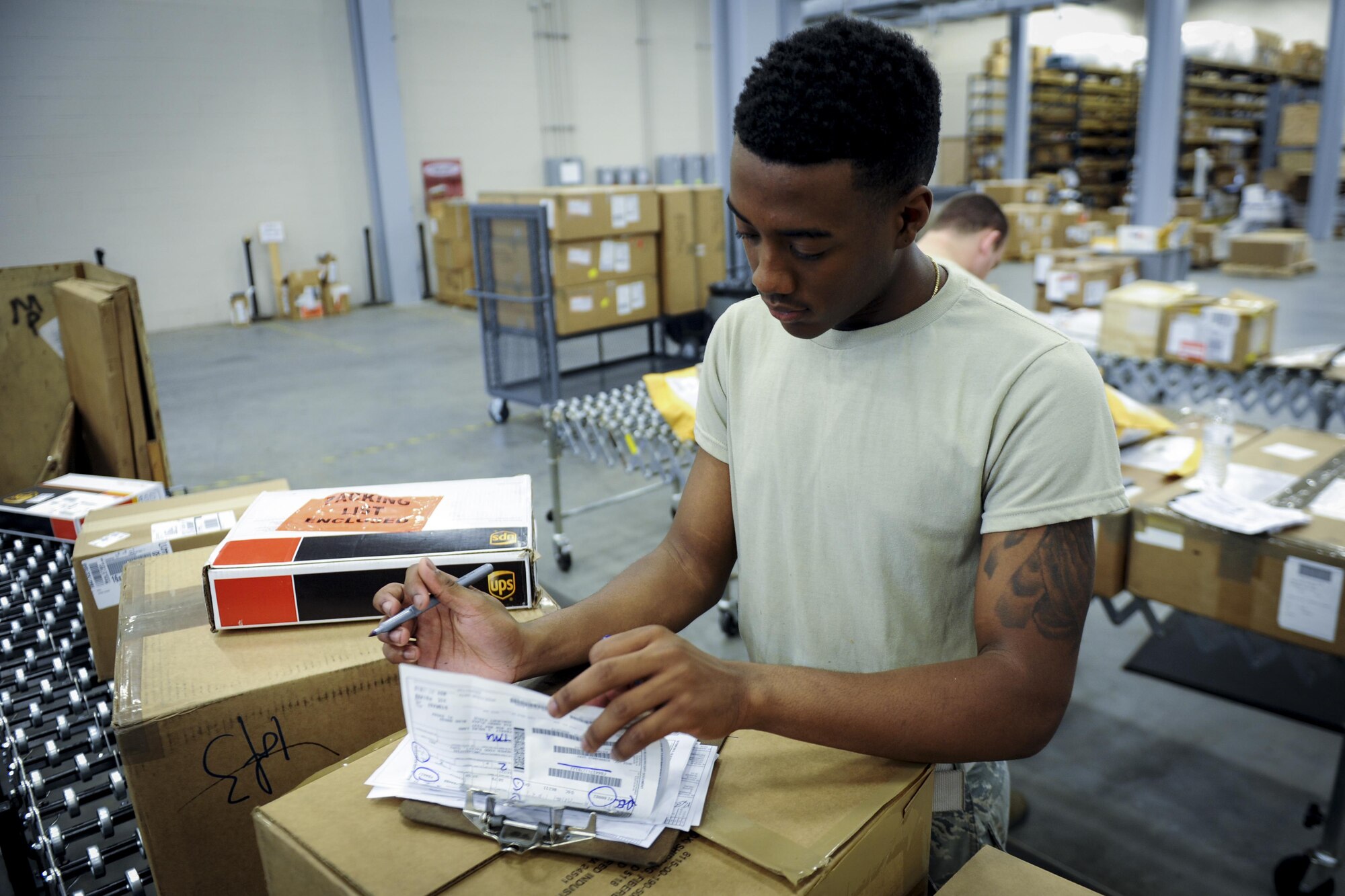 Airman Terrell Akins, a traffic management apprentice with the 1st Special Operations Logistics Readiness Squadron, fills out a shipping document at Hurlburt Field, Fla., Nov. 29, 2016. This document is used to ensure listed items are all included in the package. (U.S. Air Force photo by Airman Dennis Spain)
