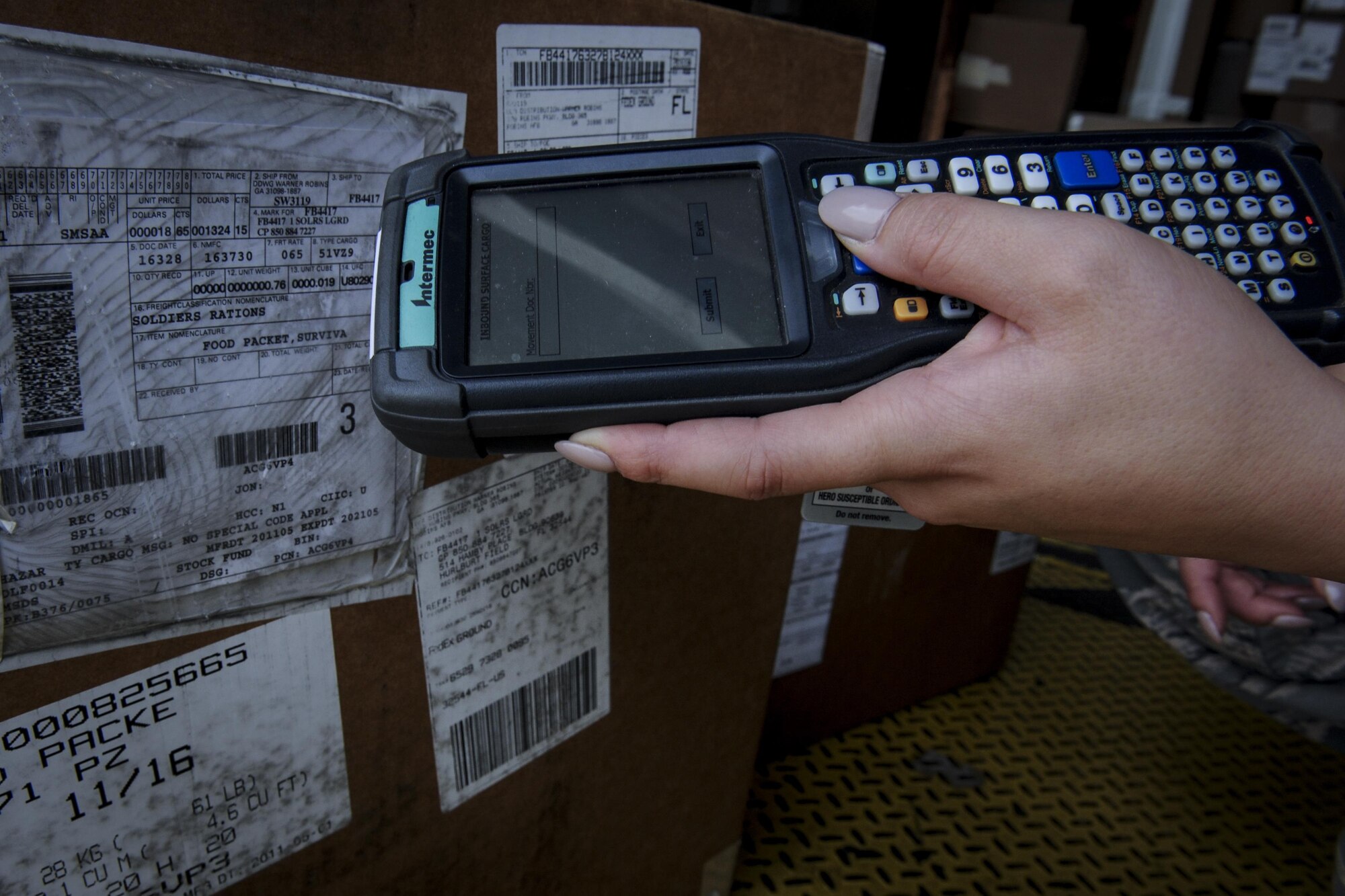 Senior Airman Samantha Wheat, a traffic management journeyman with the 1st Special Operations Logistics Readiness Squadron, uses a handheld terminal at Hurlburt Field, Fla., Nov. 29, 2016. An HHT is used to digitally receive incoming cargo and scan package documents which includes information such as what the item is, where it’s from and how many parts are included. (U.S. Air Force photo by Airman Dennis Spain)