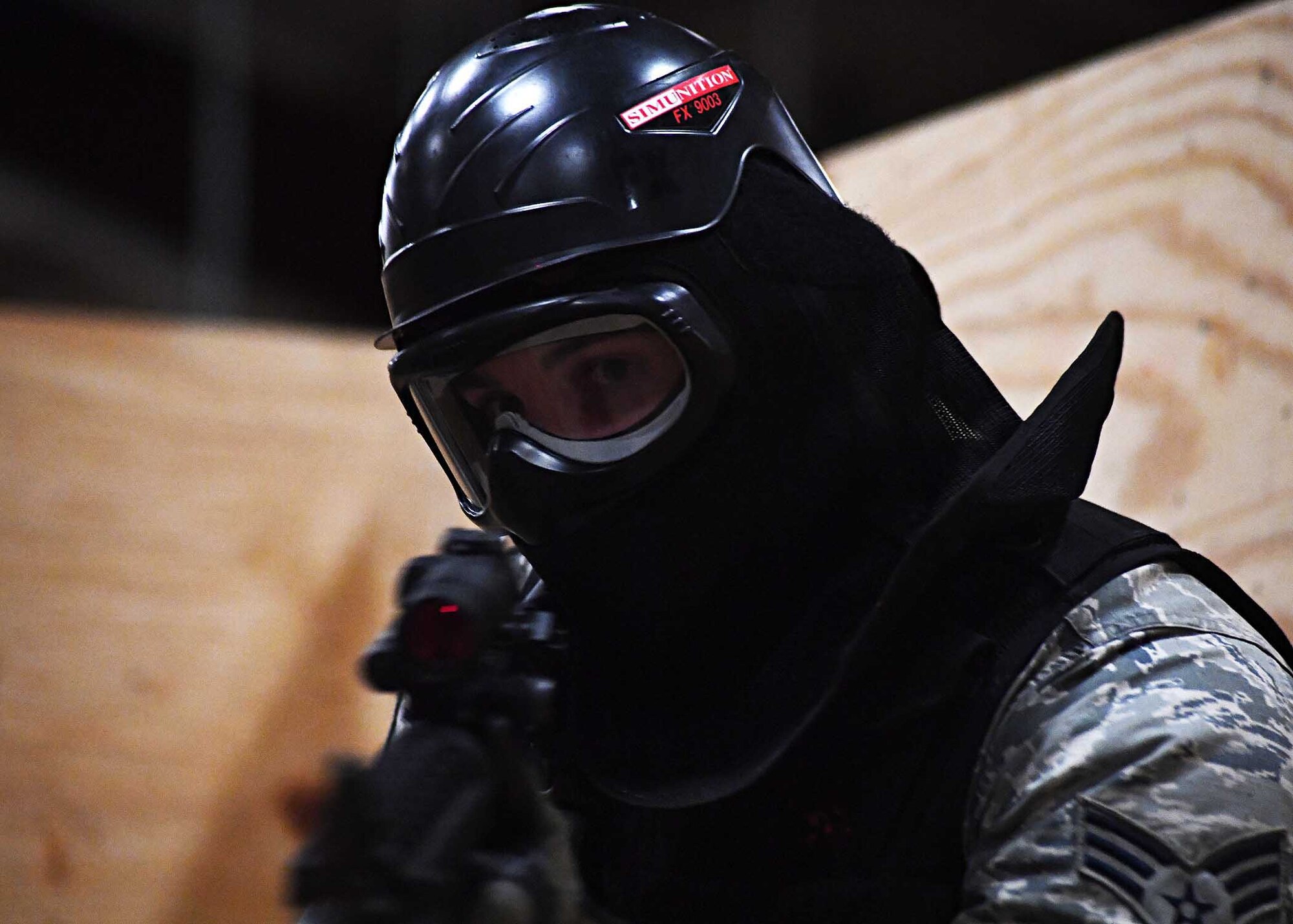 Senior Airman Nicholas Call, 319th Security Forces Squadron patrolman, looks down the barrel of a rifle Nov. 29, 2016, on Grand Forks Air Force Base, N.D. Call participated in a building clearing exercise with other members of the 319th SFS to better prepare them in the event a real-world scenario occurred. (U.S. Air Force photo by Senior Airman Ryan Sparks)