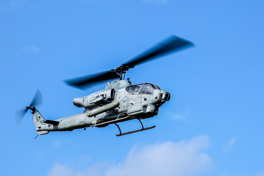 A U.S. Marine Corps AH-1W Super Cobra take flight after a static display presented by Marines of the 31st Marine Expeditionary Unit to Republic of Korea Marines and sailors on Camp Hansen, Okinawa, Japan, Nov.30, 2016. 31st MEU Marines continue to participate in events with their ROK counterparts to strengthen interoperability and partnerships. (U.S. Marine Corps photo by Lance Cpl. Jorge A. Rosales/released)