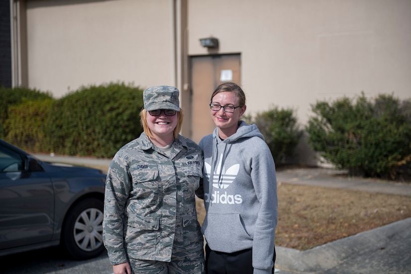 Airman Elizabeth Davis, left, 23d Communications Squadron knowledge management technician, and Airman 1st Class Ashley Moody, 23d CS client systems technician, pose for a photo, Nov. 30, 2016, at Moody Air Force Base, Ga. Davis joined the Air Force in February of 2015, with Moody’s reaction being that she’d never join the military. However, in May of 2016 after seeing Davis’s success, Moody followed her sister’s path and enlisted. (U.S. Air Force photo by Airman 1st Class Daniel Snider)