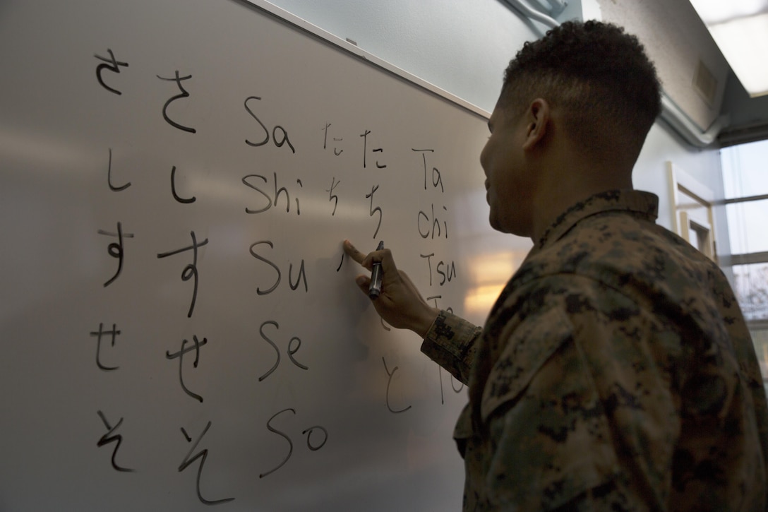 Cpl. Quindrell Fulton practices writing Japanese hiragana characters on a whiteboard during a Survival Japanese Language Class Nov. 29 on Marine Corps Air Station Futenma, Okinawa, Japan. The monthly class provides students with the opportunity to learn basic Japanese language principles. During the class, students learned about the three forms of Japanese writing, hiragana, katakana and kanji. After learning how to read and write the characters, the students practiced speaking commonly used Japanese words and phrases. Fulton is a warehouseman with Marine Aircraft Control Squadron 4, Marine Aircraft Control Group 18, 1st Marine Aircraft Wing, III Marine Expeditionary Force and is a Columbia, South Carolina, native. (U.S. Marine Corps photo by Cpl. Janessa K. Pon)
