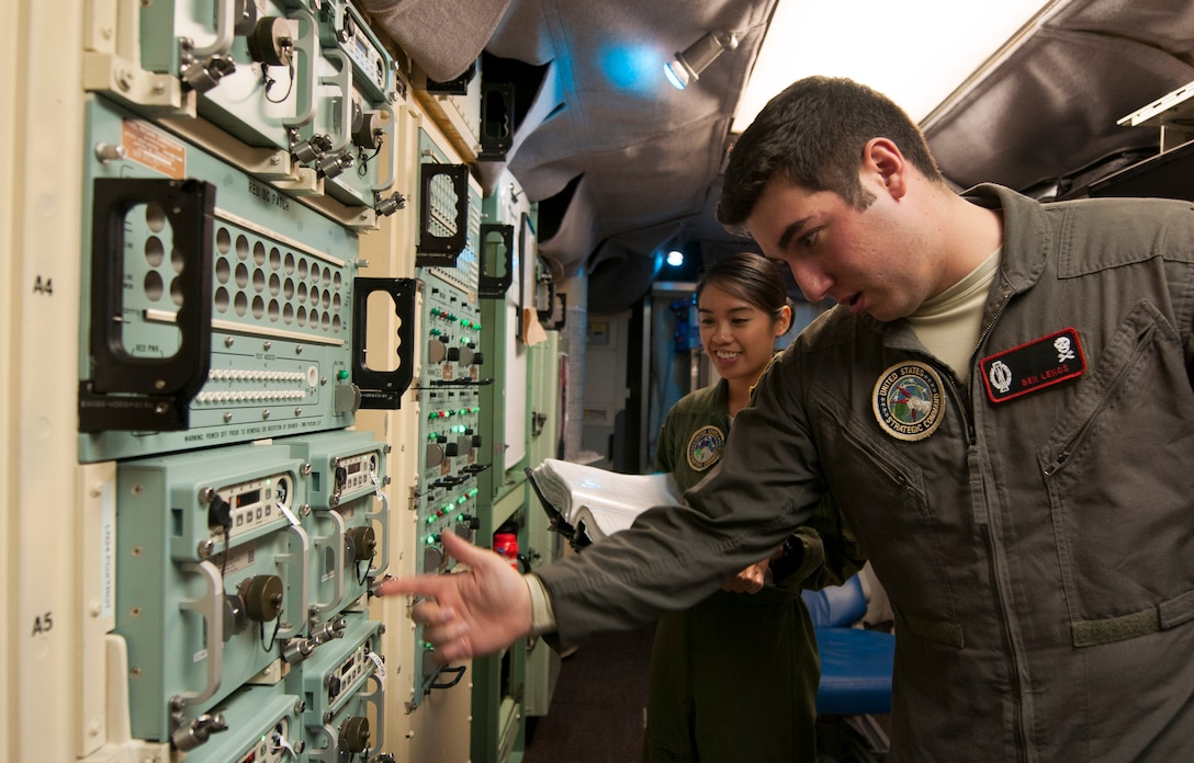 First Lt. Allia Martinez, 320th Missile Squadron missile combat crew commander and 2nd Lt. Benjamin Lenos, 320th MS deputy combat crew commander perform checks on the strategic automated command and control system in a launch control center at F.E. Warren Air Force Base, Wyo., Nov. 6, 2016. The 90th Missile Wing sustains 150 Minuteman III ICBMs and the associated launch facilities that cover 9,600 square miles across three states. (U.S. Air Force photo by Staff Sgt. Christopher Ruano)