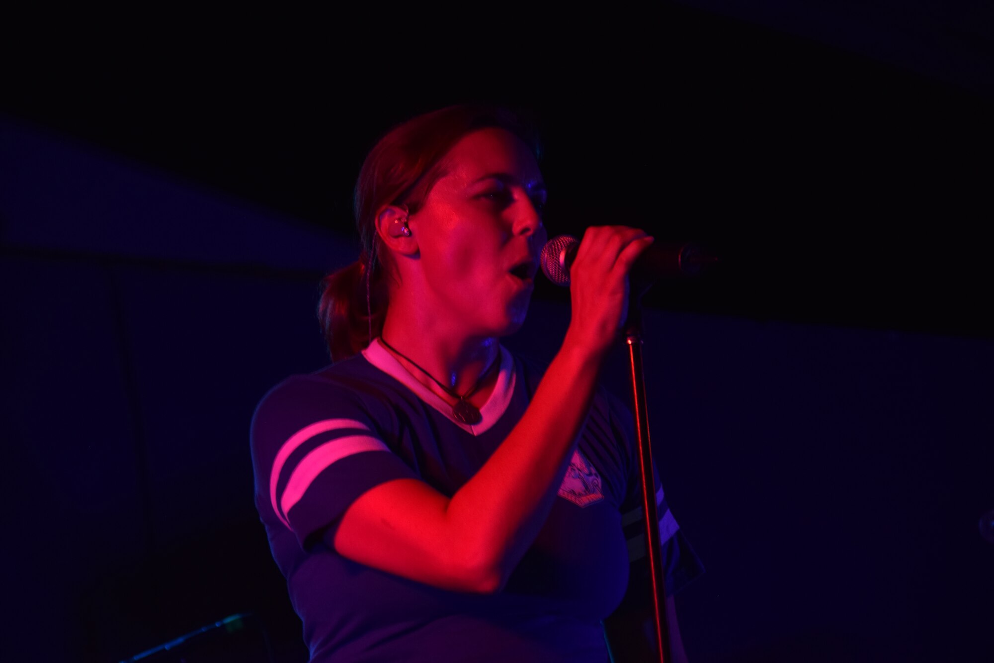 Senior Airman Alena Zidlicky, U.S. Air Forces Central Command Band vocalist, belts out a tune on stage at Memorial Plaza during the official Air Force Ball after-party Sept. 23, 2016, at Al Udeid Air Base, Qatar. The party was held following the base’s inaugural Air Force Birthday Ball to celebrate the Air Force’s 69th birthday. (U. S. Air Force photo/Tech. Sgt. Carlos J. Trevino/Released)