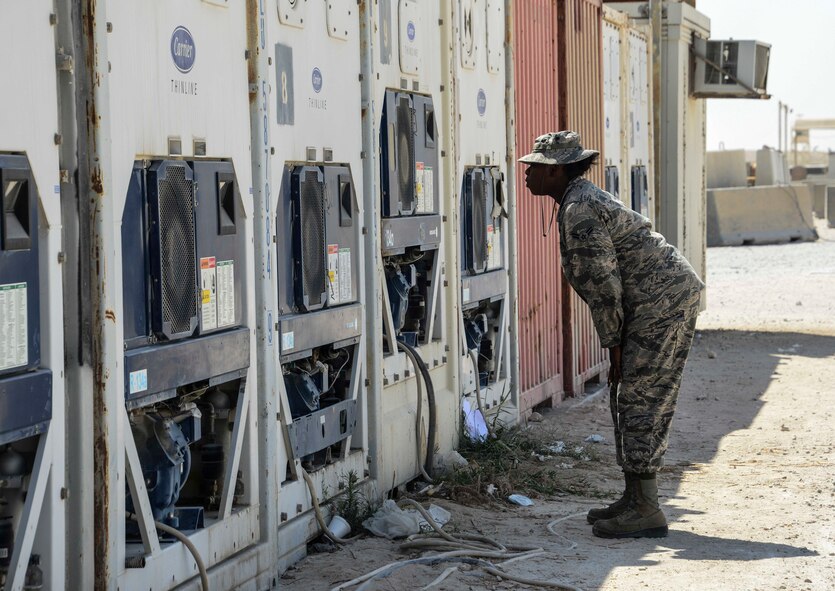 Airman 1st Class Shanette Whitehead, 379th Expeditionary Force Support Squadron service journeyman, checks the temperature of the facility’s external refrigerators and freezers Sept. 20, 2016, at Al Udeid Air Base, Qatar. Temperature checks of the external storage units are conducted every hour to ensure the food is being stored at the proper temperature. (U.S. Air Force photo/Senior Airman Janelle Patiño/Released)