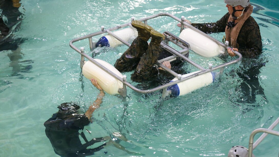 A Marine practices escaping from a seat while underwater during a training exercise at Marine Corps Base Camp Lejeune, N.C., Sept. 26, 2016. The Modular Amphibious Egress Training, also known as the Helo Dunker, teaches Marines survival techniques to use if a helicopter lands in the water. The Marines conducting the training are with 2nd Light Armored Reconnaissance Battalion.