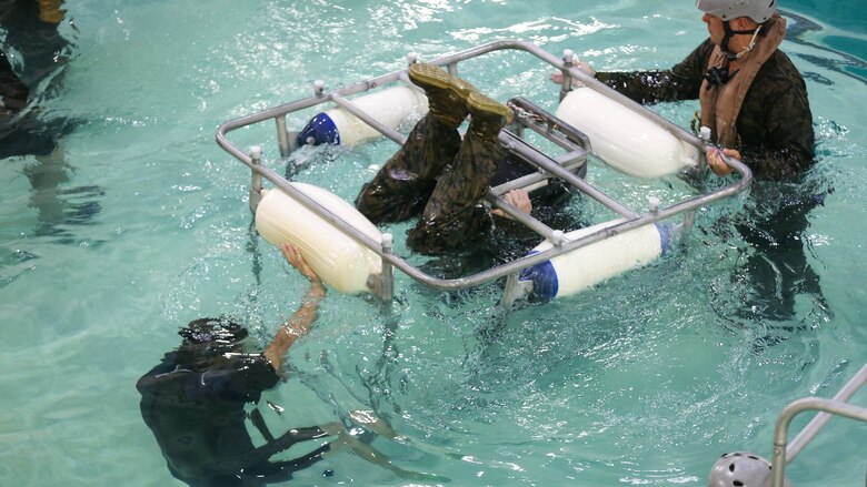 A Marine practices escaping from a seat while underwater during a training exercise at Marine Corps Base Camp Lejeune, N.C., Sept. 26, 2016. The Modular Amphibious Egress Training, also known as the Helo Dunker, teaches Marines survival techniques to use if a helicopter lands in the water. The Marines conducting the training are with 2nd Light Armored Reconnaissance Battalion.