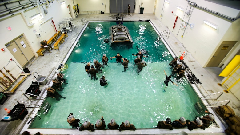 Marines prepare to be dunked under water during a training exercise at Marine Corps Base Camp Lejeune, N.C., Sept. 26, 2016. The Modular Amphibious Egress Training, also known as the Helo Dunker, teaches Marines survival techniques to use if a helicopter lands in the water. The Marines conducting the training are with 2nd Light Armored Reconnaissance Battalion. 