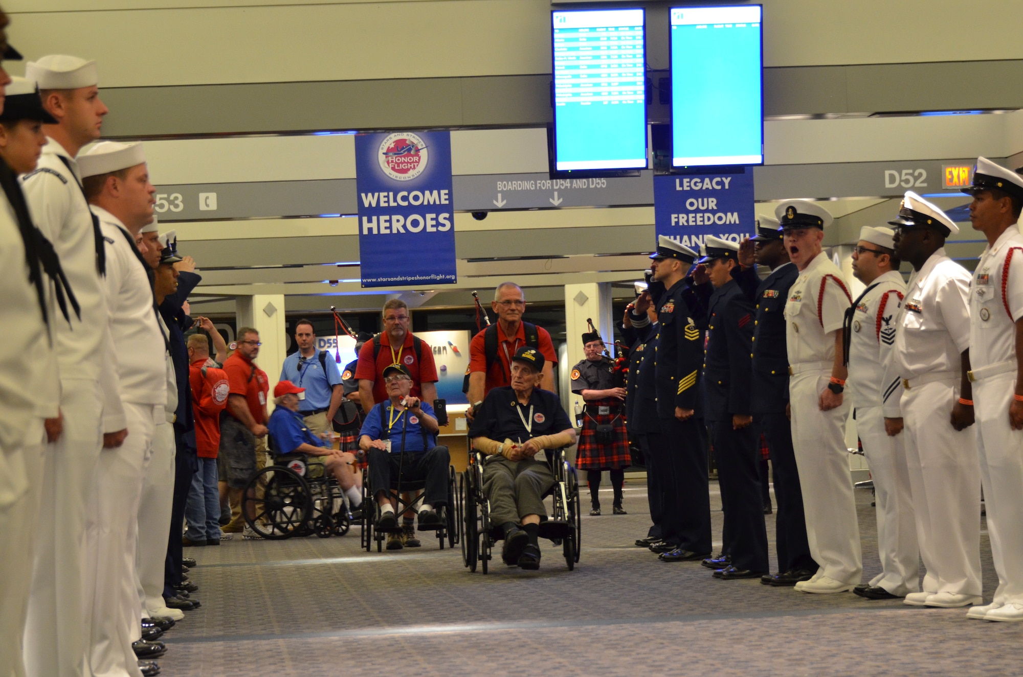 Recalling memories and making new ones: Stars and Stripes Honor Flight makes a big impact on participants and volunteers Sept. 17, 2016 at General Billy Mitchell International Airport, Milwaukee, Wisconsin. Several Airmen with the128th Air Refueling Wing joined other veteran participants, volunteers, family members and friends in the emotional evening, as approximately 600 volunteers participated in the Welcome Home Ceremony. (U.S. Air National Guard photo by Tech. Sgt. Meghan Skrepenski, 128th Air Refueling Wing Public Affairs) 