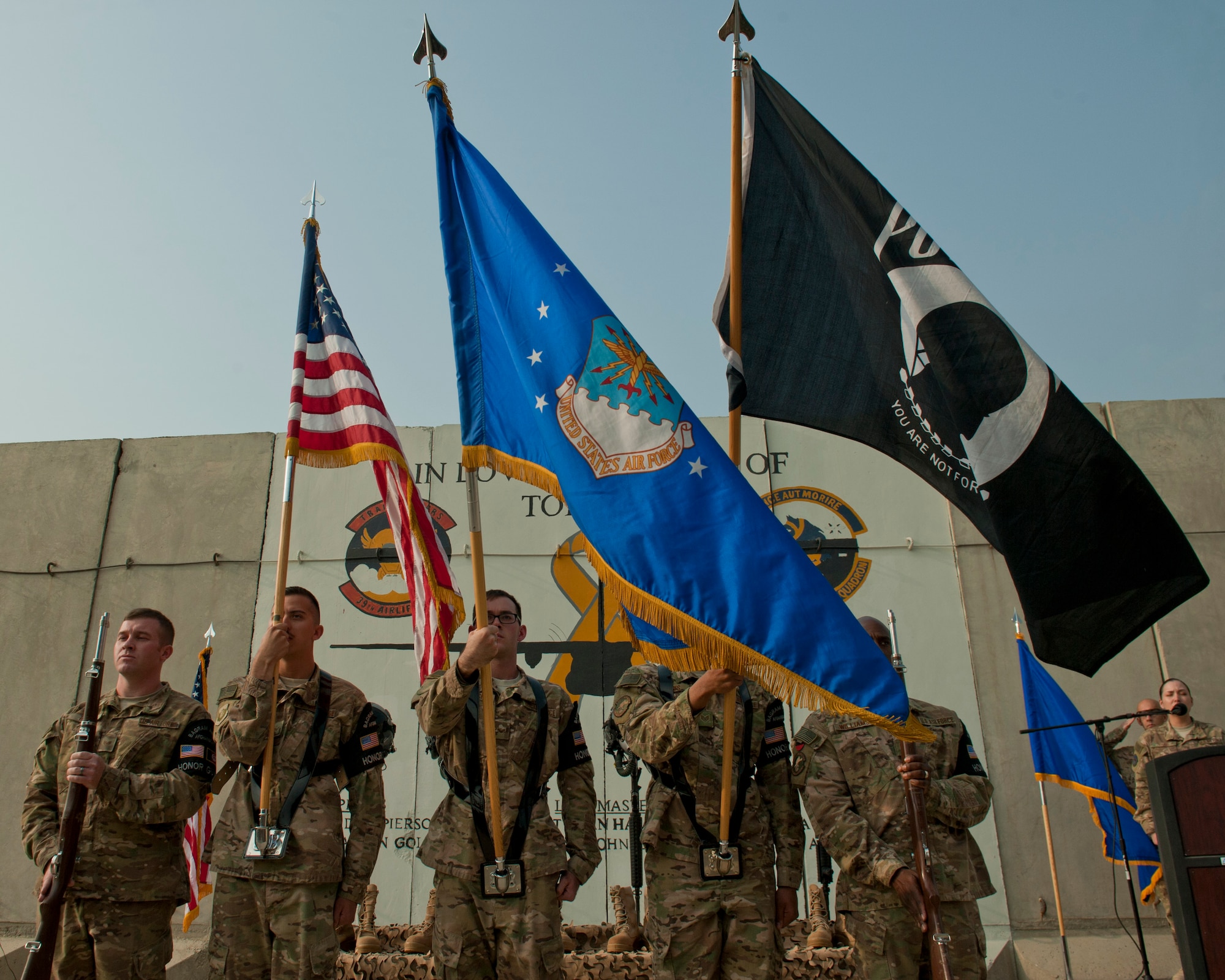 The 455th Air Expeditionary Wing Honor Guard presents the colors during a remembrance ceremony for those Airmen lost when TORQE 62 crashed, Bagram Airfield, Afghanistan, Oct. 2, 2016. TORQE 62 crashed during takeoff at Jalalabad Airfield, Afghanistan resulting in the loss of six Airmen and five contractors. (U.S. Air Force photo by Capt. Korey Fratini)