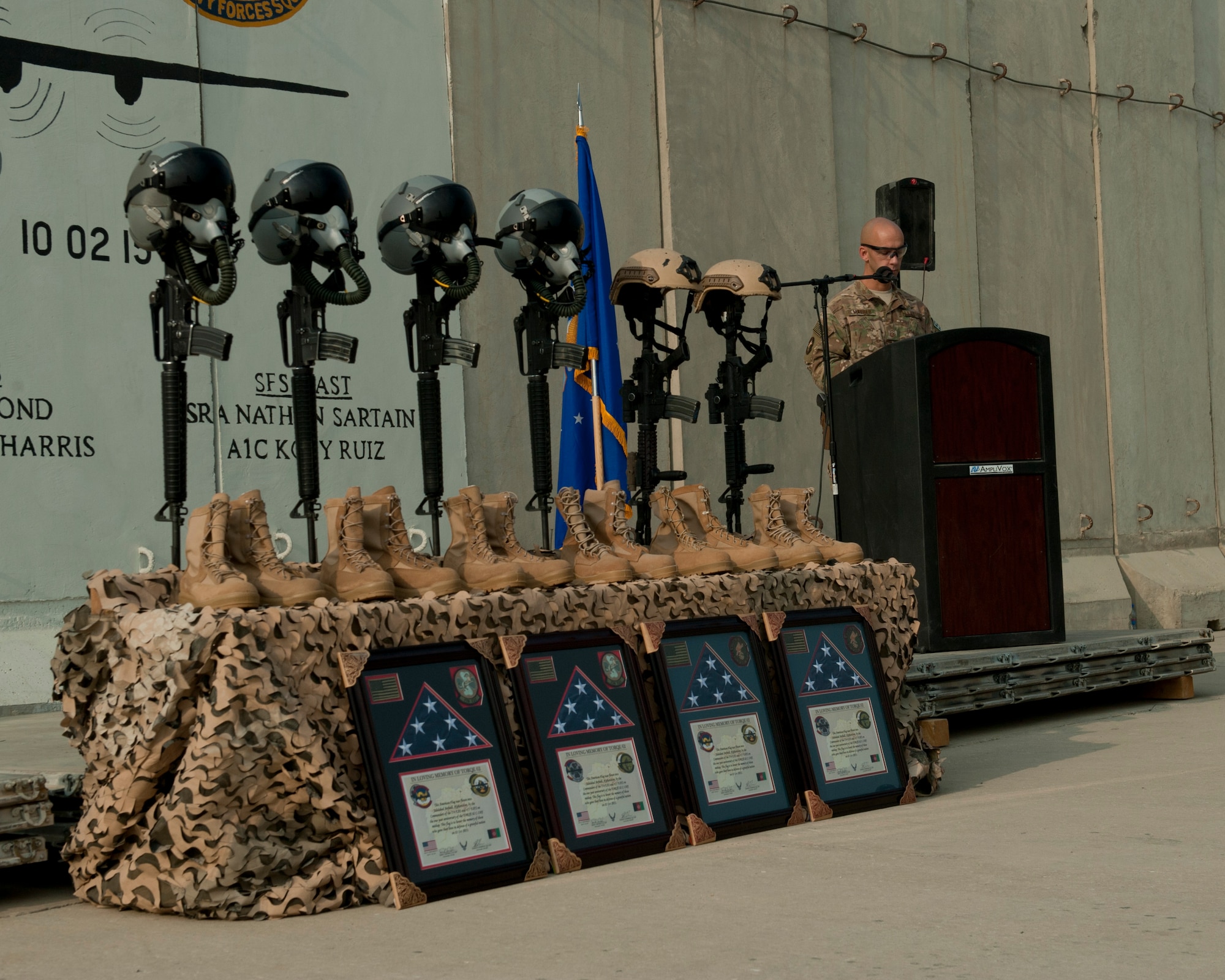 U.S. Air Force Master Sgt. Johnathon Maurer, 455th Expeditionary Security Forces Squadron, first sergeant, reads off the names of those airmen lost during the mishap of TORQE 62, Bagram Airfield, Afghanistan, Oct. 2, 2016. Airmen from the 455th AEW gathered to remember the six Airmen and five contractors lost when TORQE 62 crashed Oct. 2, 2015. (U.S. Air Force photo by Capt. Korey Fratini)