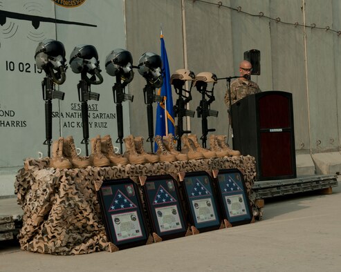 U.S. Air Force Master Sgt. Johnathon Maurer, 455th Expeditionary Security Forces Squadron, first sergeant, reads off the names of those airmen lost during the mishap of TORQE 62, Bagram Airfield, Afghanistan, Oct. 2, 2016. Airmen from the 455th AEW gathered to remember the six Airmen and five contractors lost when TORQE 62 crashed Oct. 2, 2015. (U.S. Air Force photo by Capt. Korey Fratini)