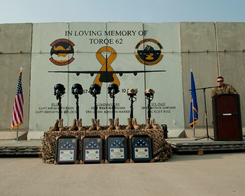 U.S. Air Force Capt. Shawn Chamberlin, 455th Expeditionary Security Forces Squadron, commander, makes remarks during the TORQE 62 remembrance ceremony, Bagram Airfield, Afghanistan, Oct. 2, 2016. Airmen from the 455th AEW gathered to remember the six Airmen and five contractors lost when TORQE 62 crashed Oct. 2, 2015. (U.S. Air Force photo by Capt. Korey Fratini)