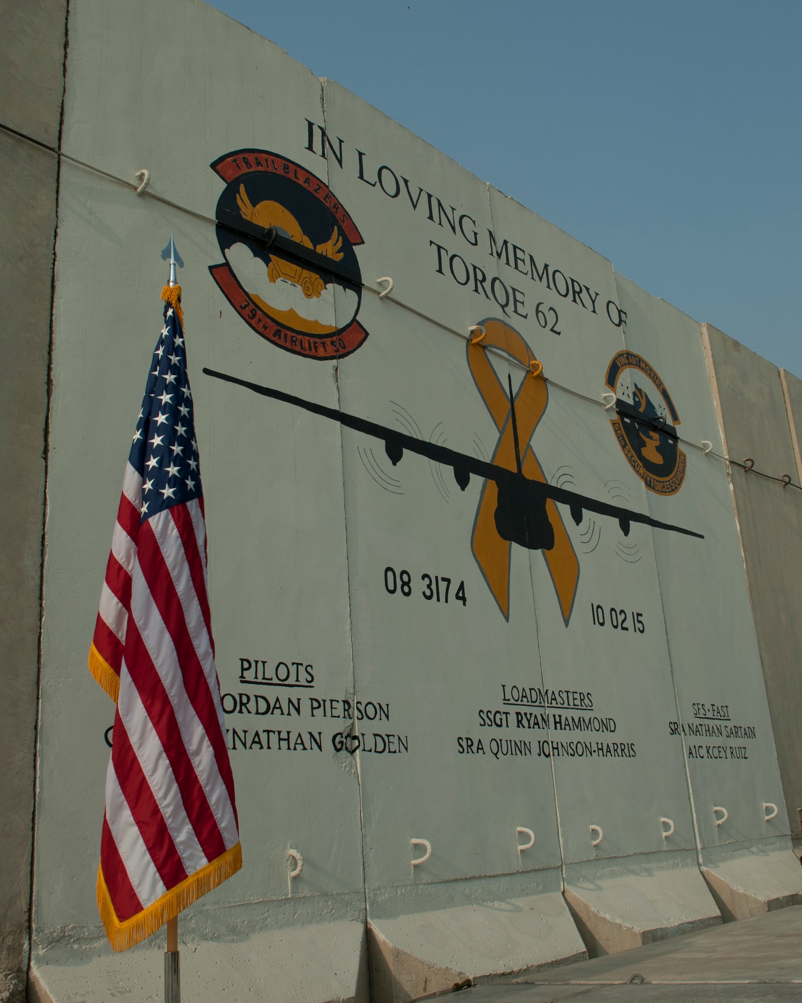 A mural on the flightline honors those Airmen who lost their lives when TORQE 62 crashed one year ago, Bagram Airfield, Afghanistan, Oct. 2, 2016. A ceremony was held to honor and remember Capt. Jordan Pierson, Capt. Jonathan Golden, Staff Sgt. Ryan Hammond, Senior Airman Quinn Johnson-Harris, Senior Airman Nathan Sartain, and Airman 1st Class Kcey Ruiz who were lost on Oct. 2, 2015. (U.S. Air Force photo by Capt. Korey Fratini)