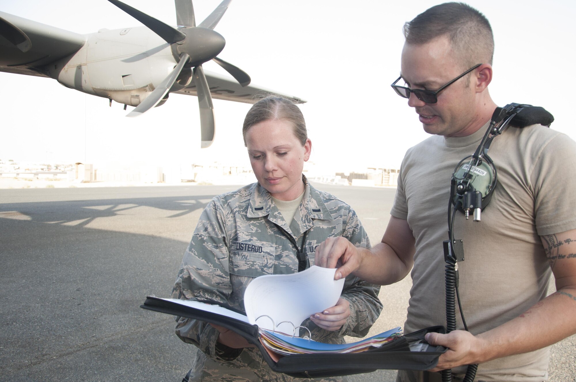 1st Lt. Solveig Listerud goes through a checklist with Staff Sgt. Justin Wise both from the 386th Expeditionary Aircraft Maintenance Squadron Sept. 27, 2016 at an undisclosed location in Southwest Asia. The overall readiness hinges on quality assurance for successful operation of the C-130 Hercules fleet.(U.S. Air Force photo by Master Sgt. Anika Jones/Released)