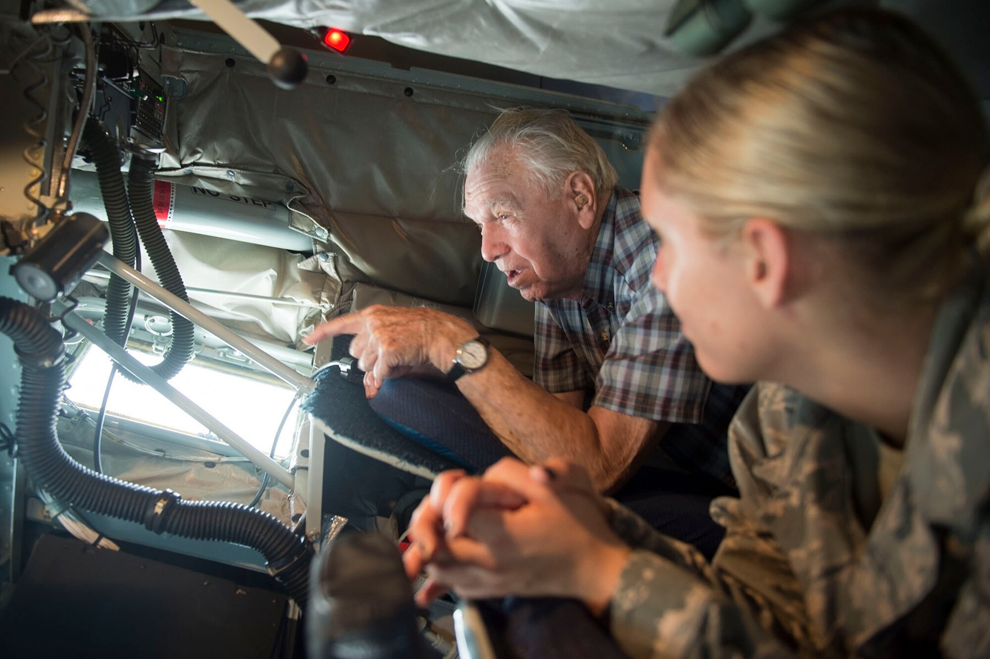 (Ret.) Lt. Col. Richard Hyman and granddaughter Senior Airman Jaclyn Hyman, 434th Aircraft Maintenance Squadron crew chief, lay in a boom pod of a KC-135R Stratotanker here during a visit Aug. 17th, 2016. Richard, a WWII and Korean War veteran, served at what was then known, Bunker Hill Air Force Base, Ind., until he retired in 1965. (U.S. Air Force photo/Staff Sgt. Jami K. Lancette)
