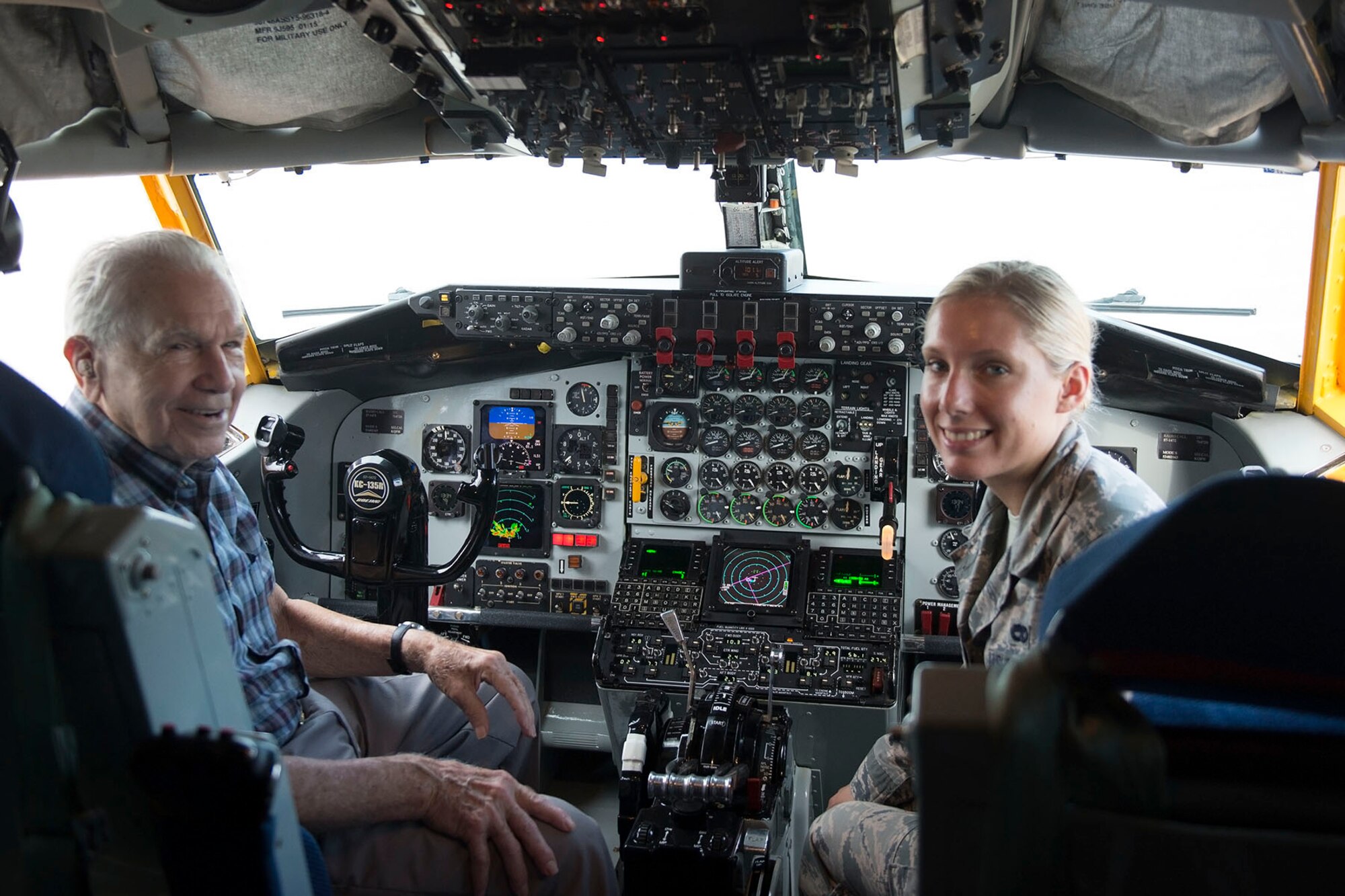 (Ret.) Lt. Col. Richard Hyman Sr. and Senior Airman Jaclyn Hyman, 434th Aircraft Maintenance Squadron crew chief sit in the cockpit of a KC-135R Stratotanker here during a visit Aug. 17th, 2016. Richard, a WWII and Korean War veteran, served at what was then known, Bunker Hill Air Force Base, Ind., until he retired in 1965. (U.S. Air Force photo/Staff Sgt. Jami K. Lancette)