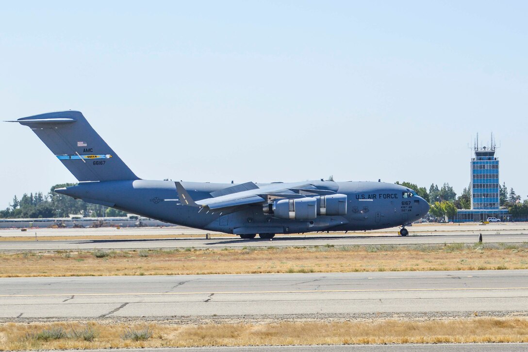 A C-17 assigned to Dover Air Force Base, Delaware, lands at the Fresno Yosemite International Airport Oct. 1, 2016. The airlifted cargo and two personnel assigned to the 144th Fighter Wing returned from a deployment in Europe as part of a theater Security Package in support of Operation Atlantic Resolve. (U.S. Air National Guard photo by Senior Airman Klynne Pearl Serrano)